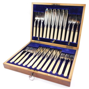 A silver plated fish canteen of cutlery, with silver ferrules and ivory handles, mahogany cased with brass escutcheons, for Fattorini & Sons, Sheffield 1907. - 4