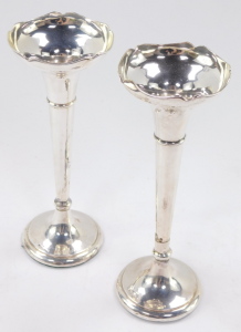 Two George V silver bud vases, having a moulded bowl, above a tapering cylindrical stem with flared base, both with loaded bases, 7cm and 8cm respectively. - 4