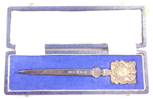 A silver paper knife, with terminal bearing the Coat of Arms of HM Queen Elizabeth II, to Commemorate her Silver Jubilee, cased, Sheffield 1977, 1.62oz. - 2