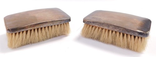 A pair of George VI silver backed hair brushes, with engine turned decoration, shield reserve, Birmingham 1937.