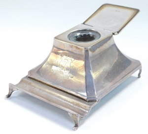 A George V loaded silver ink well and pen tray, with glass liner, of outswept form, engraved Stockport Golf Club 1930, Birmingham 1929, 11.01oz all. 9.5cm wide. - 2