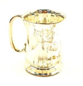 A George V silver christening tankard, of baluster form, with vertical fluting, base presentation engraved, Birmingham 1913, 4.08oz.
