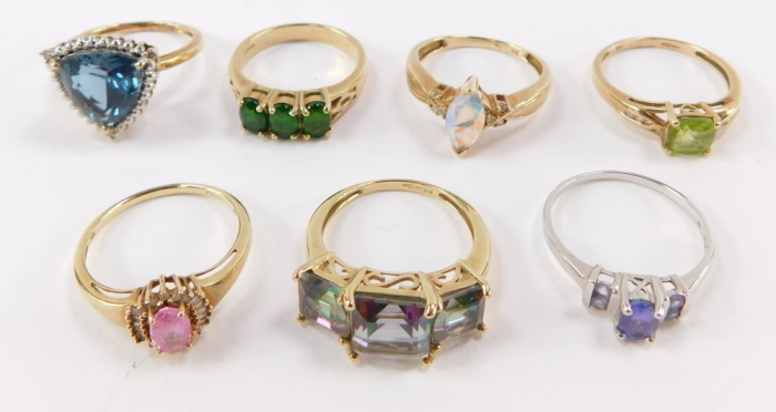 A collection of seven 9ct gold dress rings, mounted with different semi precious stones.