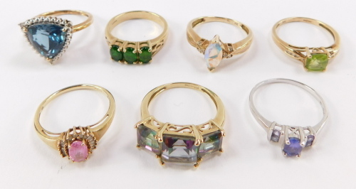 A collection of seven 9ct gold dress rings, mounted with different semi precious stones.