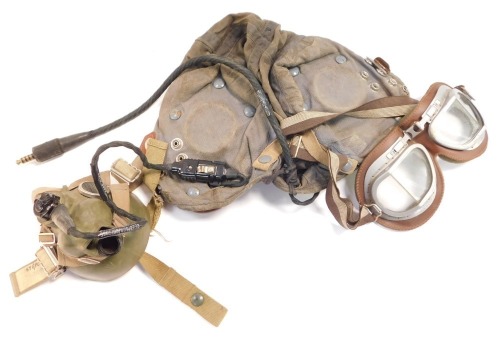 A 1968 military flying helmet, with goggles, ear defenders and mask, Cont. KX/R/886/ (1968).