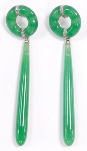 A pair of silver and jadeite earrings, in a ring and drop design.
