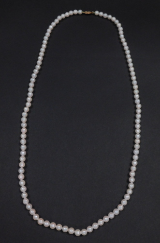 An Akoya cultured pearl necklace, on a yellow metal hook clasp, stamped 14K, each pearl approx 6.5 mm diameter.