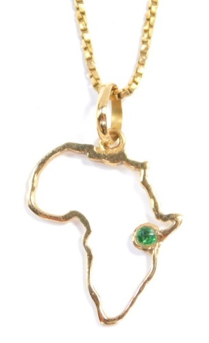 A 18ct gold and emerald set outline map of Africa pendant, on a 9ct gold cable link neck chain, on a bolt ring clasp, 4.0g all in.