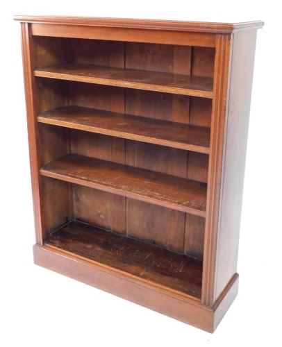 A late Victorian walnut open bookcase, the top with a moulded edge above three adjustable shelves, on a plinth, 121cm high, 100cm wide.