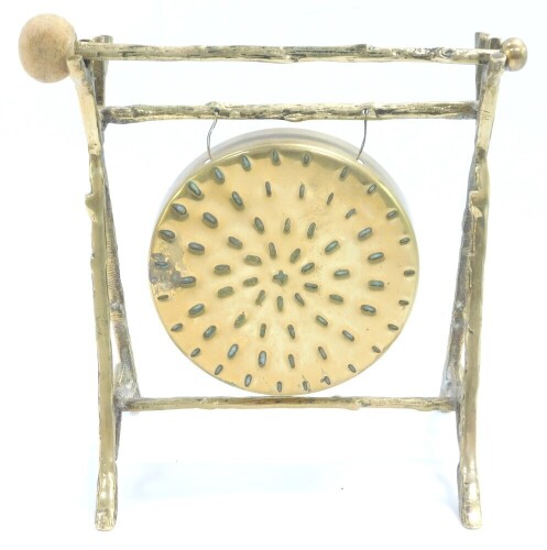 An early 20thC brass table gong, raised on a faux bamboo stand, with beater, 15.5cm wide.
