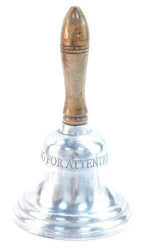 A late 20thC reception bell, with a turned wooden handle, the bell engraved 'Ring for Attention', 21cm high.