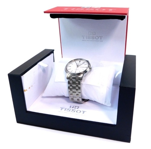 A Tissot gentleman's Automatic III stainless steel cased wrist watch, circular white dial, centre seconds, date aperture, open backed jeweled movement, serial no CHX3GGBED, boxed, with booklets.