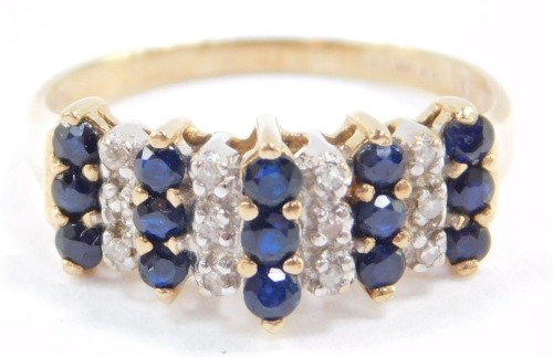 A 9ct gold sapphire and diamond ring, set with five rows of three sapphires interspersed with four rows of three diamonds, size O, 2.3g.