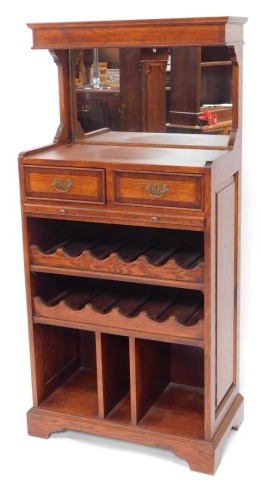 A modern oak and elm drinks serving buffet, with mirror back, two drawers and slide over wine rack and compartmental base on bracket feet, 153cm high, 70cm wide, 40cm deep.