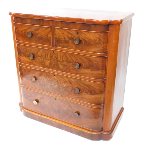 A Victorian flame mahogany bow front chest, of two short and three long cock beaded drawers on a shaped base with later circular metal handles, 113cm high, 113cm wide, 54cm deep.