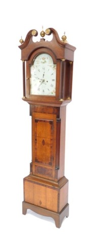 A Georgian oak and mahogany long cased clock, by Parker of Louth, the break arch dial with fruit painted spandrels, bearing Roman and Arabic numerals, subsidiary seconds dial and date aperture, two train eight day movement with bell strike, the case with 