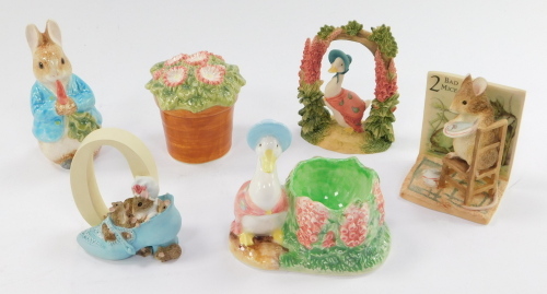 The World of Beatrix Potter ceramics figures, including The Old Woman Who Lived In A Shoe, and Peter Rabbit salt and shakers. (5)