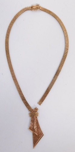 A 9ct gold brick link bracelet, in a tied design on a snap clasp, 43.0g. (AF)