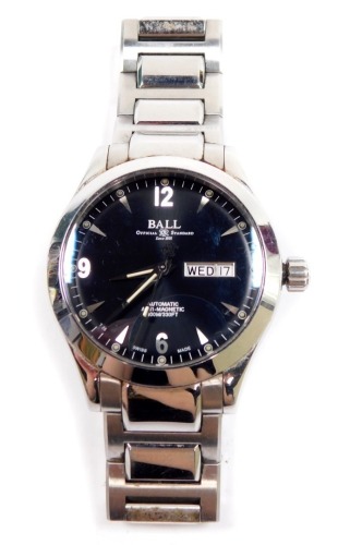 A Ball Official Standard gentleman's stainless steel cased wristwatch, circular black dial bearing Arabic numerals at quarters, centre seconds, date aperture, automatic anti - magnetic 100M - 330ft movement, on a bracelet strap, Model No MN20260S5JBK, cas