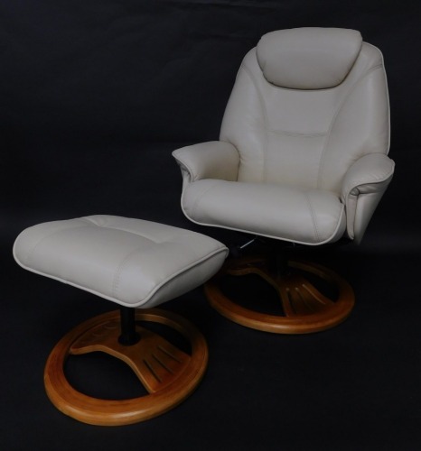 A modern cream leather armchair, on a bentwood base, and a matching stool.