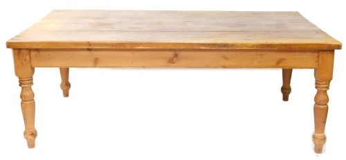 A pine kitchen table, the rectangular planked top on turned legs, 80cm high, 120cm x 213cm.