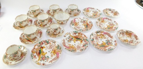 A Royal Crown Derby porcelain part tea and coffee service decorated in the Olde Avesbury pattern, comprising six tea cups, saucer and plate trios, two coffee cans with saucers, two shallow dishes and a repaired sugar bowl (AF).