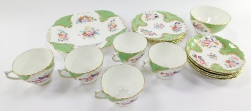 A Coalport porcelain part tea service decorated in the Rosemary pattern, comprising five cups, saucer and plate trios, sandwich plate and sugar bowl.