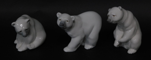 Three Lladro porcelain figures modelled as Polar bears, in various poses, 10cm high.