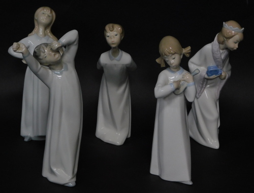 Five Lladro porcelain figures of children, the tallest 22cm high.