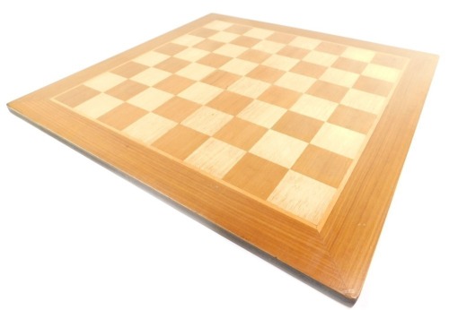 A wooden chess board, 48cm square.
