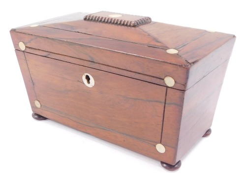 A Victorian rosewood sarcophagus tea caddy, with mother of pearl inlay, raised on bun feet, 23cm wide.