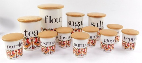 A set of Crown Devon Fieldings pottery kitchen storage jars, with turned beech covers. (11)