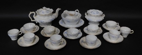 A Staffordshire early 19thC sprig moulded lilac tea service, comprising teapot, sucrier with cover, slop bowl, cream jug and plate, eleven cups (two sizes), and nine saucers. (AF)