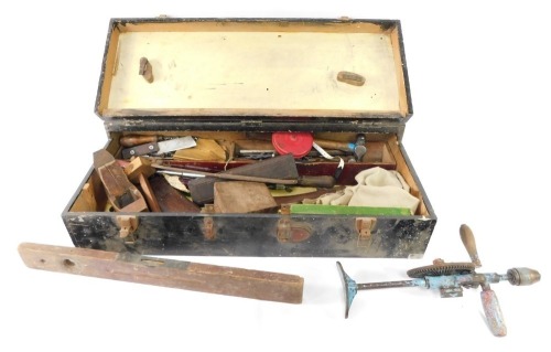 A carpenter's tool chest, including level, chisels, saw, block plane, Clipper drill, etc.