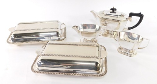 An electro plate three piece tea set, of canted form, and a pair of Art Deco silver plated entree dishes.