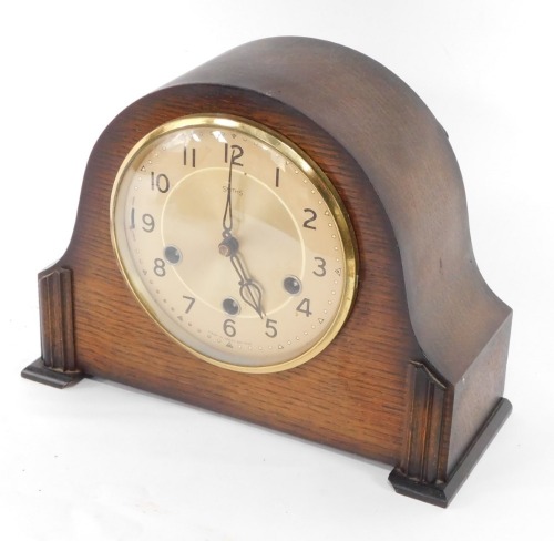 A Smiths mantel clock, with Westminster chime, in oak case, 29cm wide.