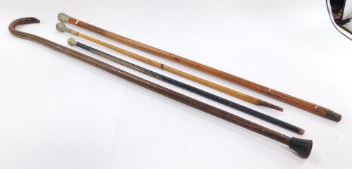A military malacca walking stick, with cast military silver plated handle, two swagger sticks and a walking stick. (4)