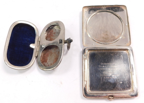 A Dubarry plated powder compact, stamped Always Handy Loose Powder Box, and a metal sovereign and half sovereign case. (AF).