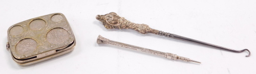 A silver plated coin case, contained some coins, a silver mounted button hook, and an engraved propelling pencil.