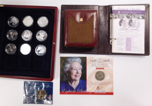 A set of nine silver commemorative medallions from the Queen Elizabeth Birthday Collection, with certificates, various nickel silver crowns, etc.