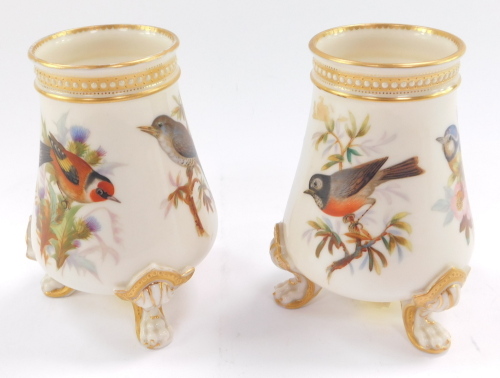 A pair of late 19thC Royal Worcester porcelain vases, each painted with birds, to include blue tits, thrush, etc., printed mark in puce to underside, 13cm high.