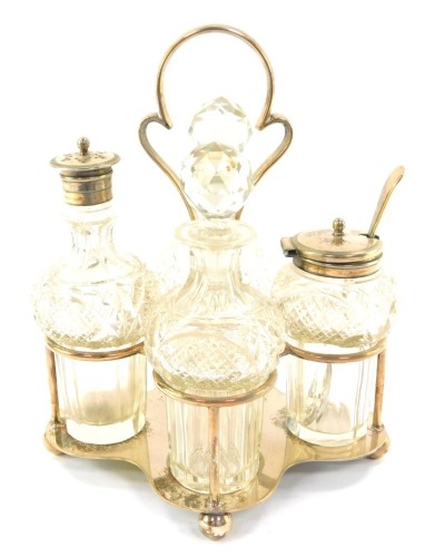 A silver plated cruet stand, with four cut crystal bottles.