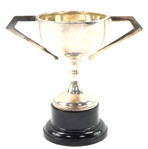 A George VI silver twin handled trophy, with a plastic socle, Birmingham 1945, 1.58oz.