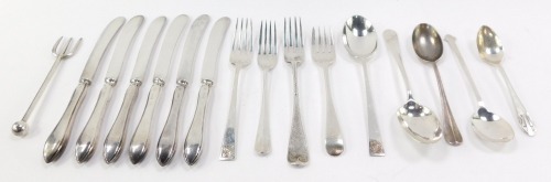 A set of six George V silver handled cake knives, Sheffield 1920, George V silver fork and spoon, London 1925, further spoons, forks, and a white metal pickle fork, 11.66oz all in.