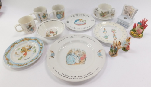 A group of Wedgwood Beatrix Potter table wares, to include plates, cups, and bowls, together with two figures. (a quantity)