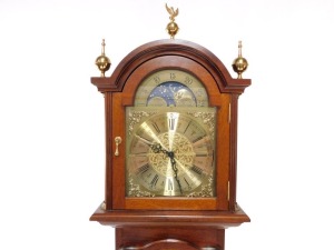 A grandmother clock, the arch dial with moon phase, star signs, etc., in a boxwood strung case with brass finials, 203cm high. - 2