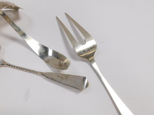 A Dutch silver early 20thC cake slice, assayed for Schoonhoven, serving fork, assayed for The Hague, and a sugar sifting spoon, 4.67oz.&nbsp; - 2