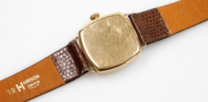 A Thomas Russell & Sons 9ct gold cased gentleman's wristwatch, with circular white ceramic dial, blue hands and seconds dial, on a brown leather strap, the watch head 2.5cm wide, 32.2g all in. - 2