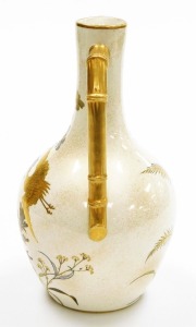 A Royal Worcester porcelain jug, on cream ground, heavily gilt decorated with storks and floral sprays and a bamboo style gilt handle, green stamp to underside, 26cm high. - 2