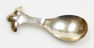 An Arts and Crafts hammered trefoil caddy spoon, by William Thomas Pavitt, London 1913, 9cm long.